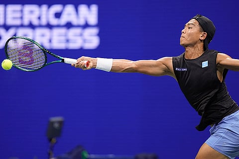 US Open 2024: Li Tu, of Australia, returns a shot to Carlos Alcaraz